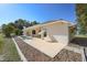Inviting rear exterior with patio, and a small private pool surrounded by lush landscaping at 1856 Nuremberg Blvd, Punta Gorda, FL 33983