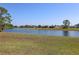 Serene waterfront property with a tranquil lake view, providing a peaceful and scenic backdrop at 1856 Nuremberg Blvd, Punta Gorda, FL 33983