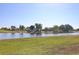 Scenic water view showcasing the tranquil pond and surrounding lush landscaping at 1856 Nuremberg Blvd, Punta Gorda, FL 33983