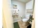 Bathroom featuring a toilet and shelving at 19505 Quesada Ave # Ii201, Port Charlotte, FL 33948