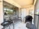 Inviting screened patio featuring comfortable seating and partial views at 19505 Quesada Ave # Ii201, Port Charlotte, FL 33948