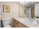 Bathroom features a single sink vanity with white countertop and a shower at 1999 Kings Hwy # 24C, Punta Gorda, FL 33980