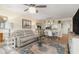 Bright dining area open to living room and kitchen offering pendant lighting and neutral decor at 1999 Kings Hwy # 24C, Punta Gorda, FL 33980