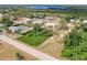 An aerial view showing the home, waterfront access, and lush tropical surroundings in a serene neighborhood at 200 Summerset Dr, Punta Gorda, FL 33982