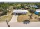 Exterior aerial shot of a single Gathering home surrounded by lush landscaping at 200 Summerset Dr, Punta Gorda, FL 33982