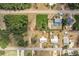 Birds eye view showing property, surrounding neighborhood, and proximity to adjacent empty lot at 200 Summerset Dr, Punta Gorda, FL 33982