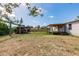 Large backyard with a swing set, shed, covered porch, and ample space for activities at 200 Summerset Dr, Punta Gorda, FL 33982
