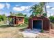 Backyard featuring a shed and a small open garage at 200 Summerset Dr, Punta Gorda, FL 33982