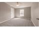 Comfortable bedroom with neutral carpet, ceiling fan, and a window for natural light at 200 Summerset Dr, Punta Gorda, FL 33982