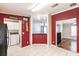 Bright kitchen and eating area with decorative wall art, and seamless tile floors at 200 Summerset Dr, Punta Gorda, FL 33982