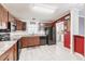 Functional kitchen featuring updated appliances, counter tops, and tile floors at 200 Summerset Dr, Punta Gorda, FL 33982