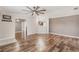 Spacious living room with wood floors and an open view to the modern kitchen at 200 Summerset Dr, Punta Gorda, FL 33982