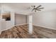 Open-concept living area with wood floors and neutral paint, next to the kitchen at 200 Summerset Dr, Punta Gorda, FL 33982