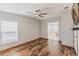 Bright main bedroom with wood floors and an ensuite bathroom with a soaking tub at 200 Summerset Dr, Punta Gorda, FL 33982