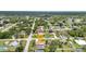 Aerial view showcases a lovely home with a pool in a leafy residential neighborhood at 20355 Mount Prospect Ave, Port Charlotte, FL 33952