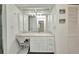 Bathroom with vanity, bright lights, decorative trim, and built in storage at 20355 Mount Prospect Ave, Port Charlotte, FL 33952