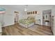 Bright bedroom with hard wood floors, ceiling fan and beach themed comforter and pillows at 20355 Mount Prospect Ave, Port Charlotte, FL 33952