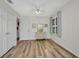 Bedroom featuring wood-look floors, a ceiling fan, a window, and ample closet space at 20355 Mount Prospect Ave, Port Charlotte, FL 33952