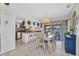 Eat-in kitchen with granite countertop, bar stool seating and cozy dining area next to the patio door at 20355 Mount Prospect Ave, Port Charlotte, FL 33952