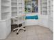 Bright office space featuring custom built-ins, a built-in bench, and a corner desk setup at 20355 Mount Prospect Ave, Port Charlotte, FL 33952
