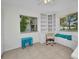 Home office with custom built-ins, bench seating, and natural light from two windows at 20355 Mount Prospect Ave, Port Charlotte, FL 33952
