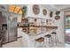 Bright kitchen with granite counters, stainless steel appliances, breakfast bar, and decorative wall art at 20355 Mount Prospect Ave, Port Charlotte, FL 33952