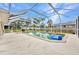 Beautiful pool with a screened enclosure, surrounded by a spacious patio area for relaxing and entertaining at 20355 Mount Prospect Ave, Port Charlotte, FL 33952