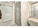 Bathroom shower featuring window, privacy blinds, built in storage, and decorative chair at 20355 Mount Prospect Ave, Port Charlotte, FL 33952