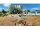 Backyard oasis with a pond, fire pit, and an outdoor seating area for relaxation and entertainment at 20407 Albury Dr, Port Charlotte, FL 33952