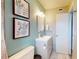 Bathroom featuring a modern vanity, decorative artwork, and a clean, bright aesthetic at 20407 Albury Dr, Port Charlotte, FL 33952