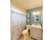 Bathroom features a shower-tub combination and a single vanity with a light wood grain at 20407 Albury Dr, Port Charlotte, FL 33952