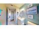 A bright bathroom vanity offers plenty of counter space for toiletries and getting ready at 20407 Albury Dr, Port Charlotte, FL 33952