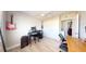 A spare bedroom makes a great music studio with a desk, guitars, and piano at 20407 Albury Dr, Port Charlotte, FL 33952