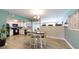 Cozy dining area featuring pendant lighting and views into the kitchen at 20407 Albury Dr, Port Charlotte, FL 33952