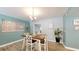 Charming dining room with modern chandelier, wood table set and colorful decor accents at 20407 Albury Dr, Port Charlotte, FL 33952
