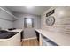 Efficient laundry room with modern washer and dryer, ample counter space, and practical storage solutions at 20407 Albury Dr, Port Charlotte, FL 33952