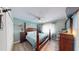 Main bedroom with natural light, ceiling fan, and coordinated decor that creates a relaxing space at 20407 Albury Dr, Port Charlotte, FL 33952