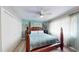 Spacious main bedroom features neutral colors, a ceiling fan, and large window with lots of natural light at 20407 Albury Dr, Port Charlotte, FL 33952