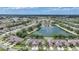 A scenic aerial view highlights the community's layout, featuring lush greenery, picturesque lakes, and well-maintained landscaping at 2087 Lynx Run, North Port, FL 34288