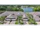 Breathtaking aerial view of the property showcasing the tile roof, landscaping, and serene water views at 2087 Lynx Run, North Port, FL 34288