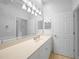 Bright bathroom featuring a large vanity, ample lighting, and neutral color palette at 2087 Lynx Run, North Port, FL 34288