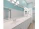 Bathroom with double sink vanity, large mirror and tile floor at 2087 Lynx Run, North Port, FL 34288
