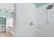 Bathroom with white tiled shower and chrome shower head, as well as a white vanity and tile floor at 2087 Lynx Run, North Port, FL 34288