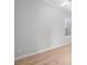 Bedroom featuring wood-look floors and a window with white shutters at 2087 Lynx Run, North Port, FL 34288
