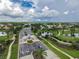A community entrance features meticulous landscaping and a gated entry, ensuring privacy and an appealing welcome at 2087 Lynx Run, North Port, FL 34288