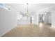 Open dining area with tile flooring, neutral paint, and views to kitchen at 2087 Lynx Run, North Port, FL 34288