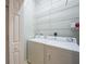 Laundry room with washer, dryer, and wire shelving at 2087 Lynx Run, North Port, FL 34288