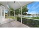 Patio with scenic lake views, and screened enclosure at 2087 Lynx Run, North Port, FL 34288