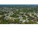 Aerial view of a home in a green residential area with nearby canals at 2113 Barksdale St, Port Charlotte, FL 33948