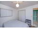 Well-lit bedroom with spacious closet space and a ceiling fan fixture at 2113 Barksdale St, Port Charlotte, FL 33948